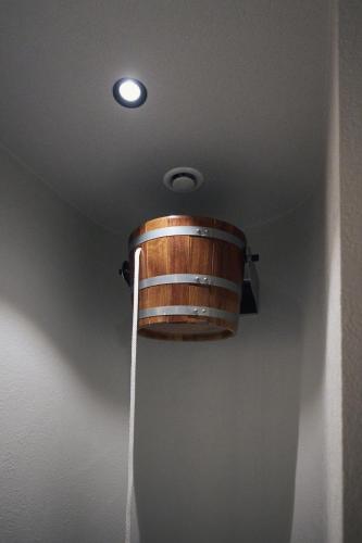 a wooden barrel on the ceiling of a room at Triangel Boutique Hotel in Kranjska Gora