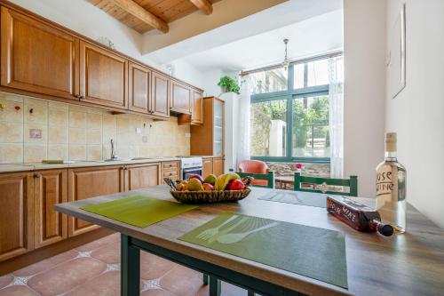 a kitchen with a bowl of fruit on a table at Dream House in Perivólia