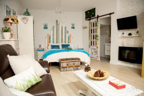 Televisyen dan/atau pusat hiburan di Apartamentos Rincón de Cantarranas