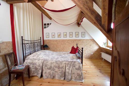 En eller flere senge i et værelse på Chambre d'hôtes du Moulin de Landonvillers