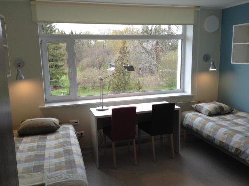 Postel nebo postele na pokoji v ubytování Hiiumaa Ametikooli Accommodation