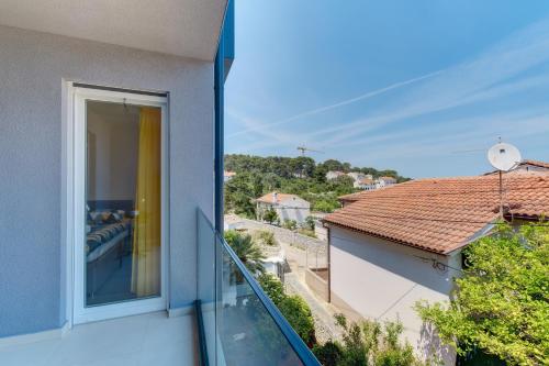 a view from a balcony of a house at Apartments Hemetek in Veli Lošinj