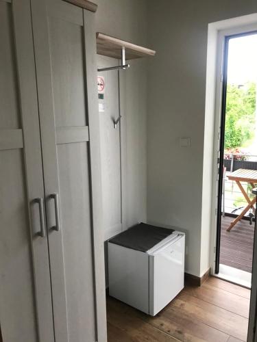 a room with a white cabinet and a door at Pension SALMA in Český Krumlov