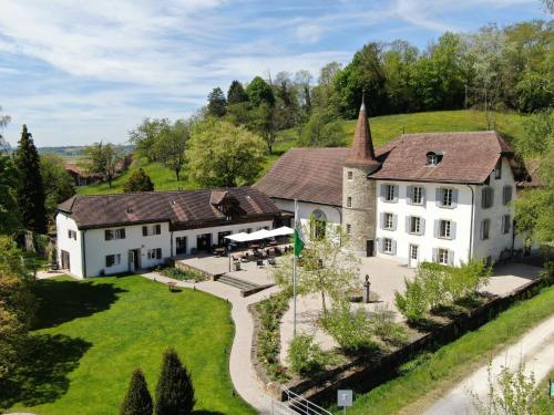 an aerial view of a large white house at Château Salavaux in Salavaux