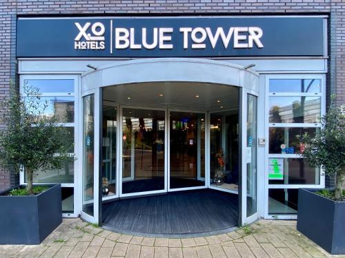 an entrance to a blue tover store with revolving doors at XO Hotels Blue Tower in Amsterdam