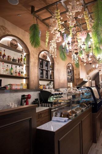 a restaurant with a bar with a counter top at Odos Oneiron Boutique Hotel in Chania