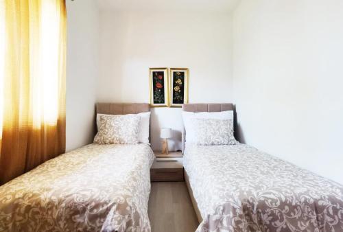 two beds sitting next to each other in a bedroom at Casa Sol Maris in Novigrad Istria