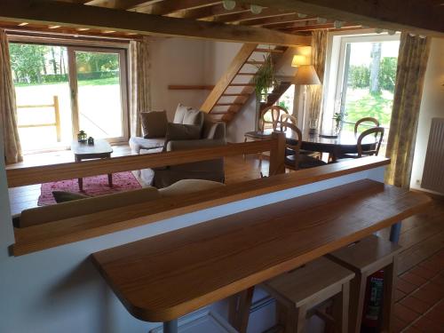 a living room with a couch and a table at Gite de Miavoye calme nature chaleur vue in Onhaye