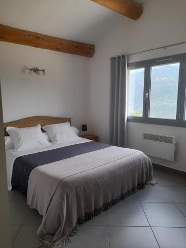Ένα ή περισσότερα κρεβάτια σε δωμάτιο στο Chambres d'Hôtes Villa Cardellini