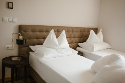 Ansitz am Eck by Hotel Pernhofにあるベッド