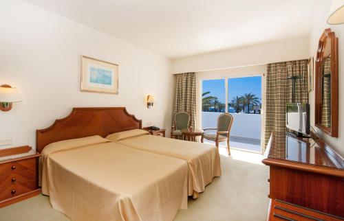 Giường trong phòng chung tại Relaxia Olivina