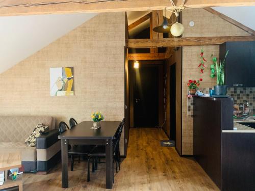 a kitchen and a dining room with a table in a room at Beautiful Apartment on Atoneli in Tbilisi City