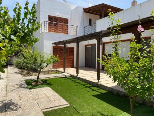 a view of a house with a yard at Demelida Villa in Tsada, Paphos in Tsadha