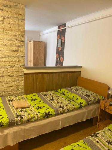 Postel nebo postele na pokoji v ubytování Apartmany Judita Kissová