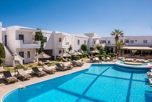 an image of a swimming pool at a resort at Enorme Maya Beach Hotel-Adults Only in Gouves