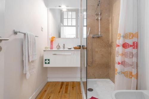 a bathroom with a shower and a sink at LV Premier Apartments Baixa- FI in Lisbon