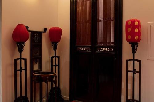 a room with two red lanterns next to a door at Wabi Sabi B&B - a Japanese sleep oasis in Belgium in Grote-Brogel