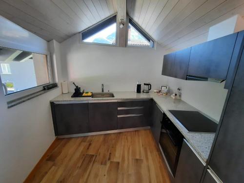 a kitchen with a sink and a counter top at B&B Cà Nosa in Gordevio