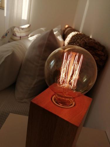 a glass bowl with lit candles on a table at Bellagio Holiday Home in Bellagio