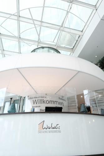 a view of a building with a glass ceiling at Webers - Das Hotel im Ruhrturm in Essen