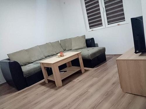 a living room with a couch and a coffee table at Dany Apartments in Gevgelija