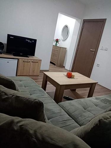a living room with a couch and a table at Dany Apartments in Gevgelija