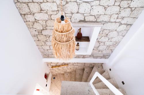 a chandelier hanging from the ceiling of a house at ZOE ALAÇATI in Alacati