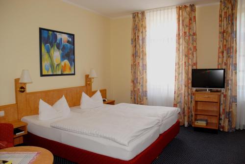 Postel nebo postele na pokoji v ubytování Hotel Alte Schule