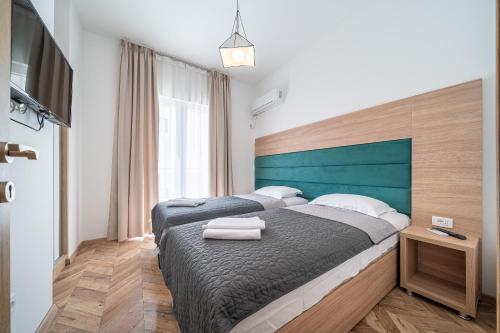 Sun and Sea Apartmentsにあるベッド