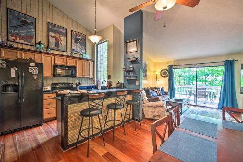 a kitchen with a large island in the middle of a room at Cozy Wintergreen Resort Condo Walk to Ski Lifts! in Lyndhurst