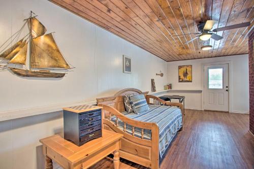 a bedroom with a bed and a boat on the wall at Possum Kingdom Lakefront Home with Patio and Dock! in Graford