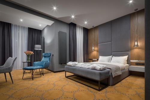 Postel nebo postele na pokoji v ubytování Hotel Raymond