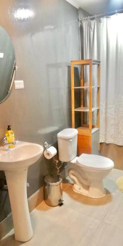 a bathroom with a toilet and a sink at Le Marche Bed & Breakfast in Santiago