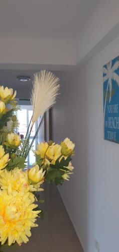 a bunch of yellow flowers sitting on a table at Ema in Vama Veche