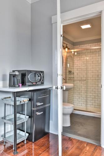 a kitchen with a sink and a toilet in a bathroom at The Burrell House in Keene