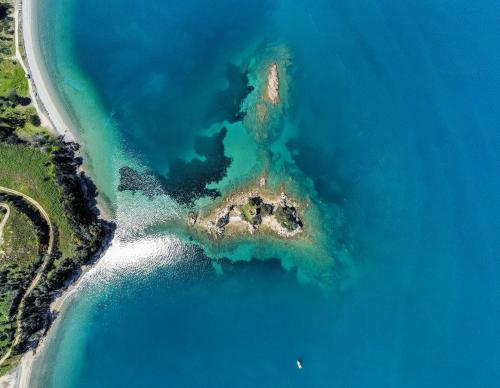 an aerial view of an island in the ocean at Kiki's Apartments in Néos Pírgos