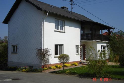 a white house with a black roof at Urlaub auf dem Bauernhof Marx in Kelberg