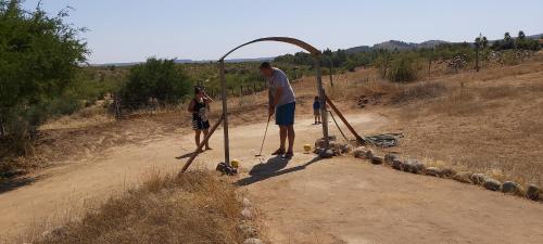 two people are standing on a dirt road with a pole at Willy's Country Club Cauquenes in De Cauquenes