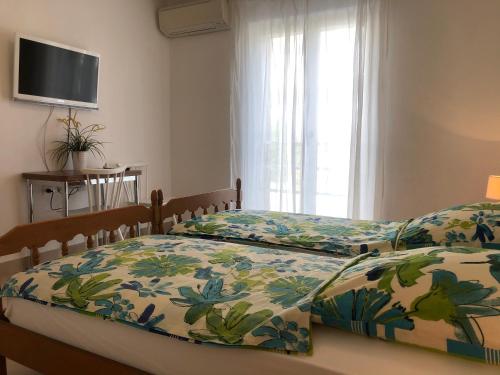 Postel nebo postele na pokoji v ubytování Dalmatia Apartments