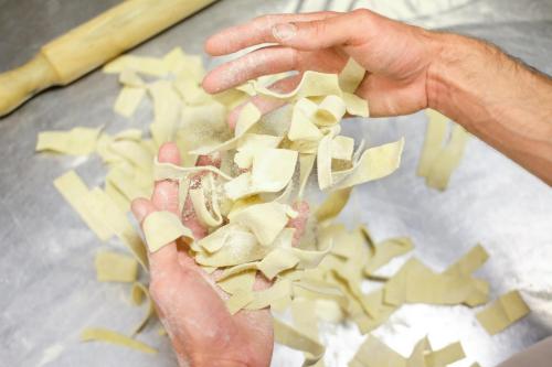 a person holding up a pile of cut up onions at Masseria Sant'Agapito in Lucera
