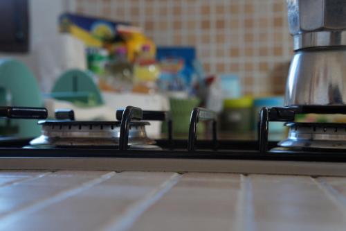 a close up of a stove top in a kitchen at antonella home in Brindisi