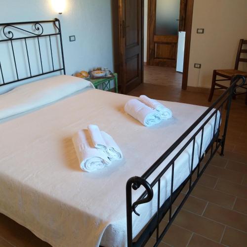 Postel nebo postele na pokoji v ubytování Agriturismo Funtan'Arva