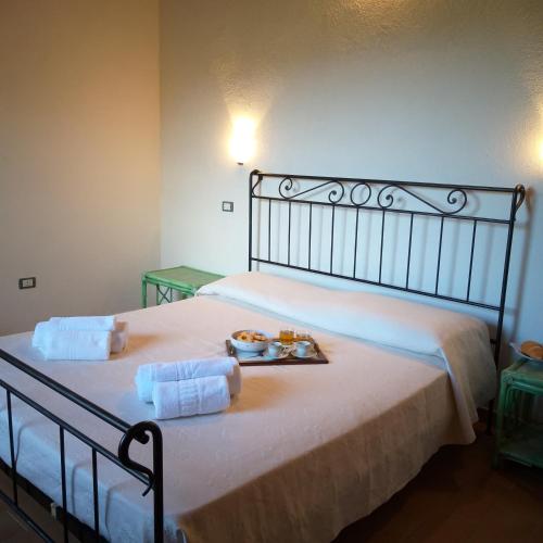 Postel nebo postele na pokoji v ubytování Agriturismo Funtan'Arva