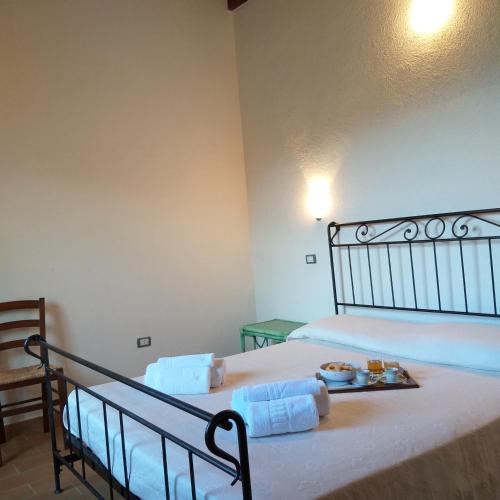 Postel nebo postele na pokoji v ubytování Agriturismo Funtan'Arva