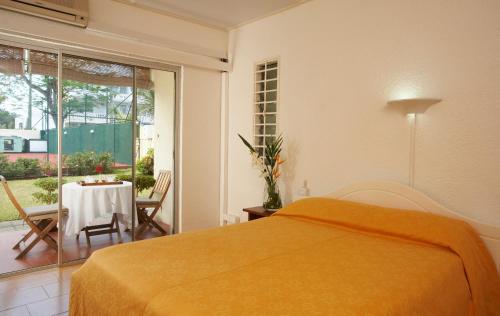 A bed or beds in a room at La Pointe Villas