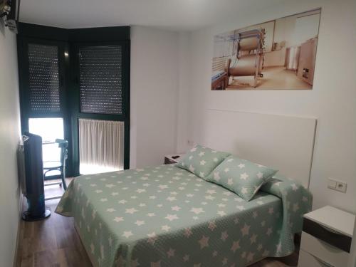 Postel nebo postele na pokoji v ubytování Edificio Valles del Lúpulo (DUPLEX)
