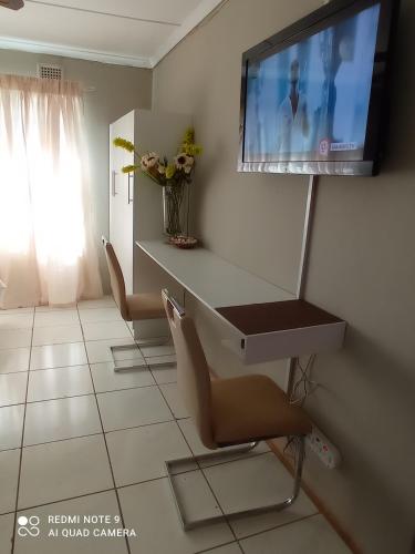 TV a/nebo společenská místnost v ubytování Atholl Heights Home - BnB 1