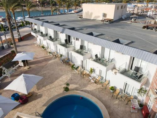 an overhead view of a hotel with a swimming pool at Sea Gull Marina Hotel in El Alamein