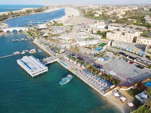 an aerial view of a marina with boats in the water at Sea Gull Marina Hotel in El Alamein