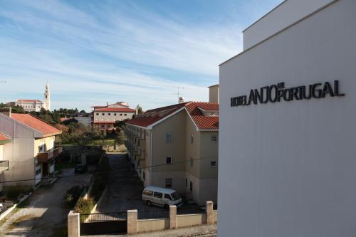 a building with a sign that reads international at Hotel Anjo de Portugal in Fátima